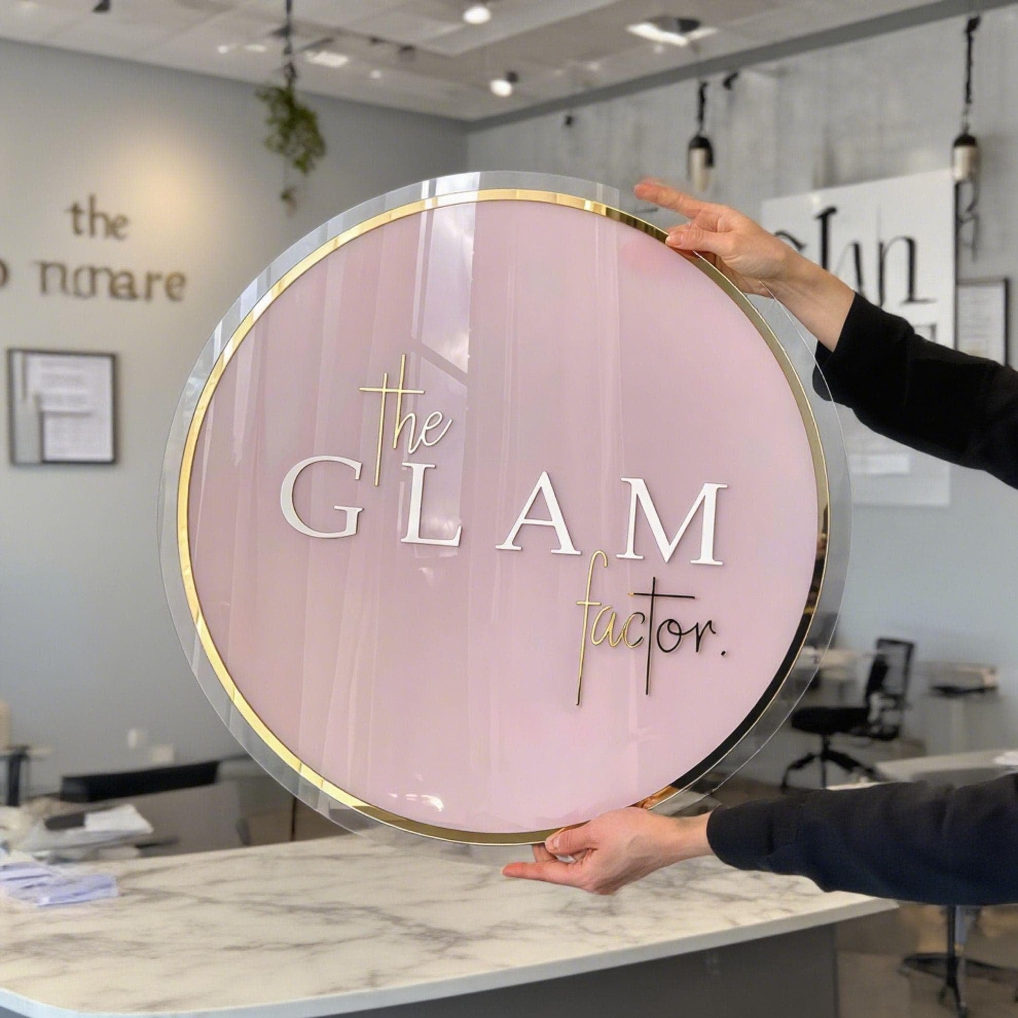🌟 Round Acrylic Logo Sign – Rose Gold & White Letters with Pink Base